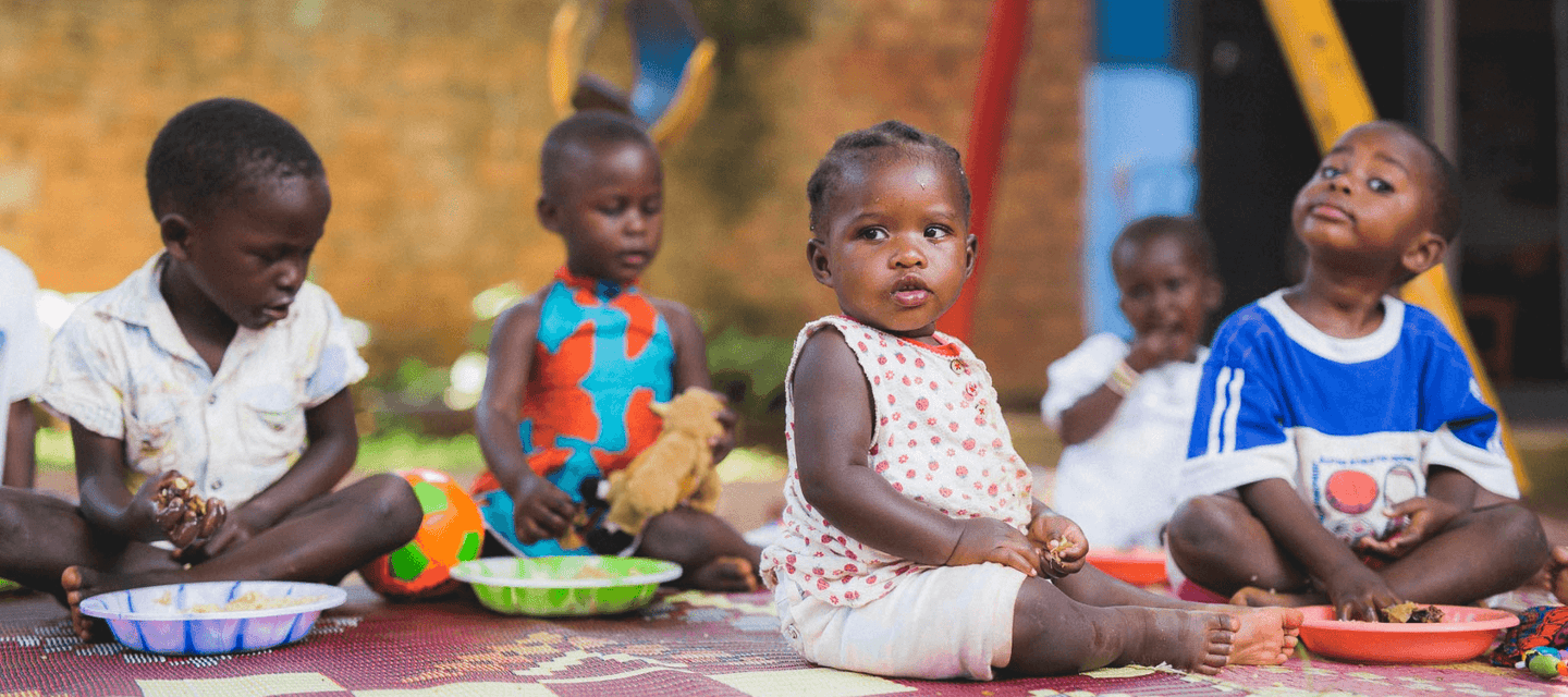 children enjoying their meal at family strengthening daycare programme