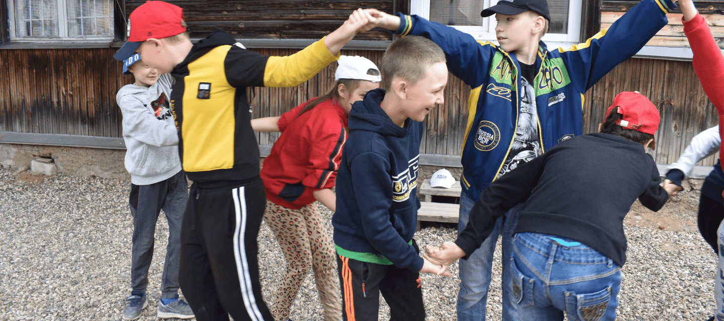 Children enjoying camp activities at month-long summer day camp